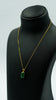 Gilded Emerald Elegance Pendant